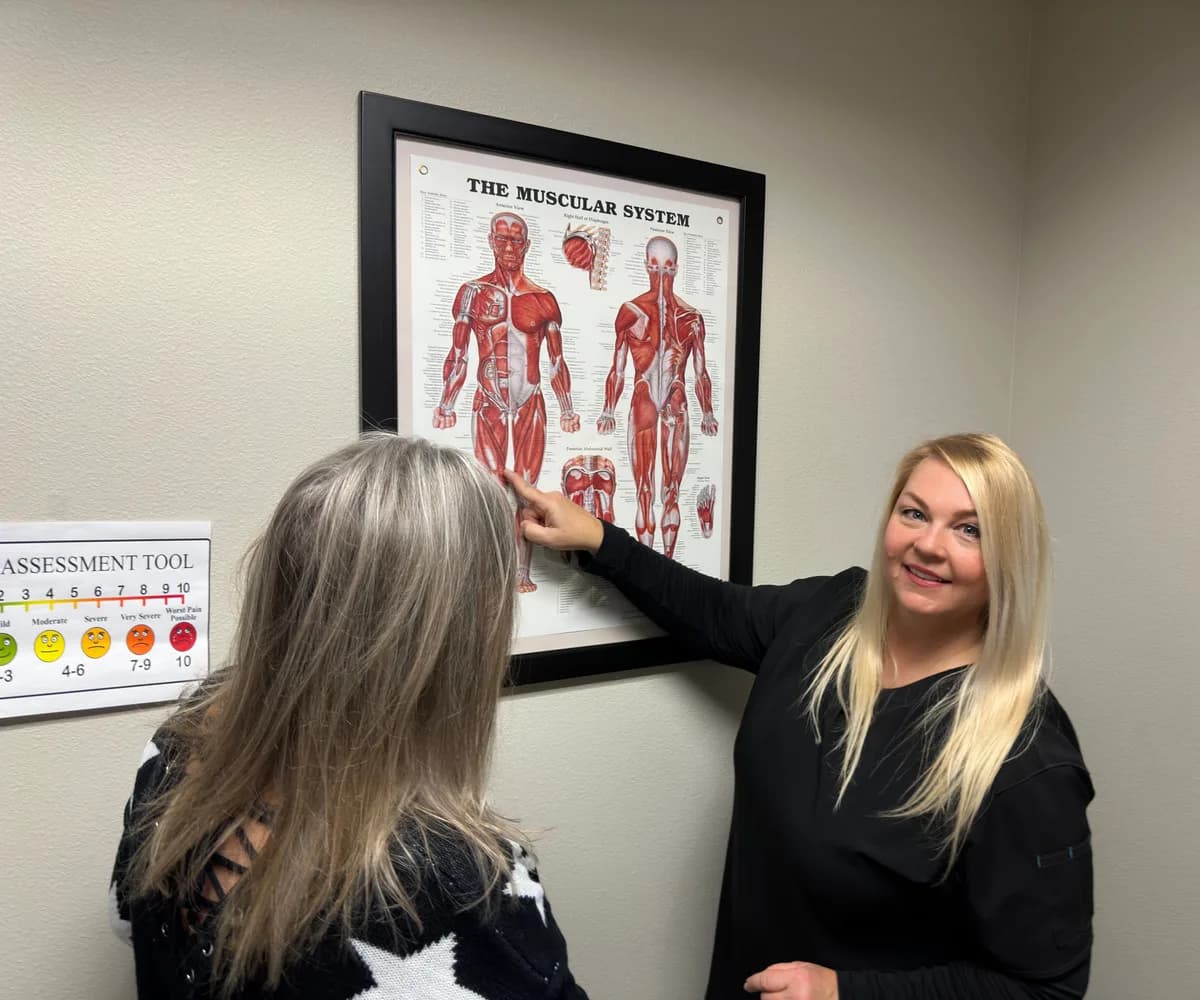 Dr. Michelle Binkowski explaining nerve anatomy to a migraine patient at Back in Action Chiropractic in Las Vegas