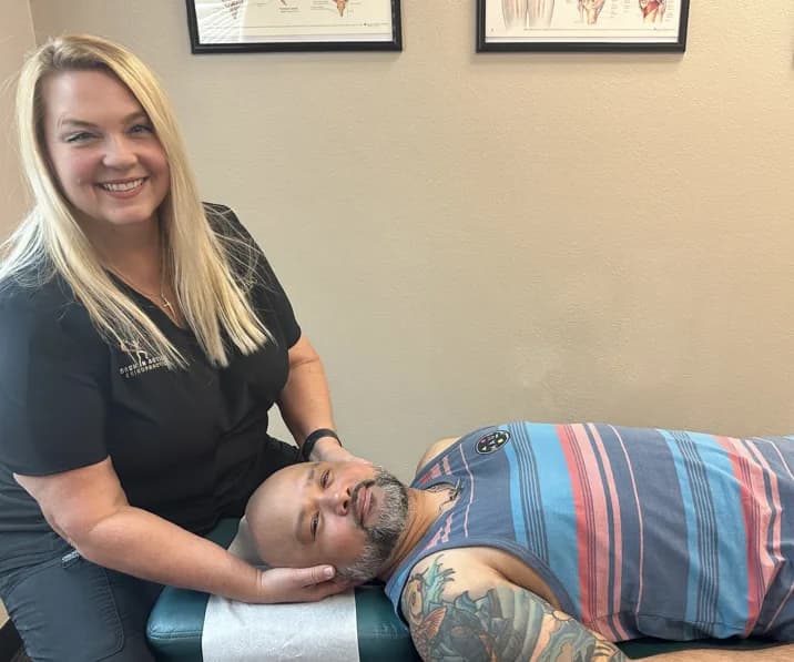 Dr. Michelle Binkowski performing a cervical spine adjustment for neck pain at Back in Action Chiropractic in Las Vegas