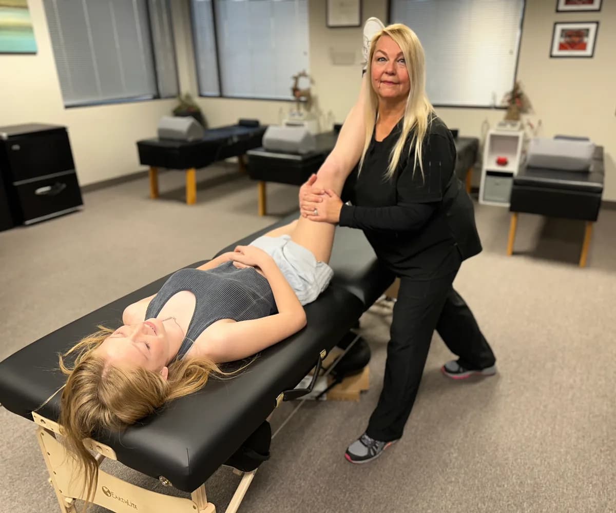Dr. Michelle Binkowski performing a chiropractic adjustment on a patient at Back in Action Chiropractic in Las Vegas