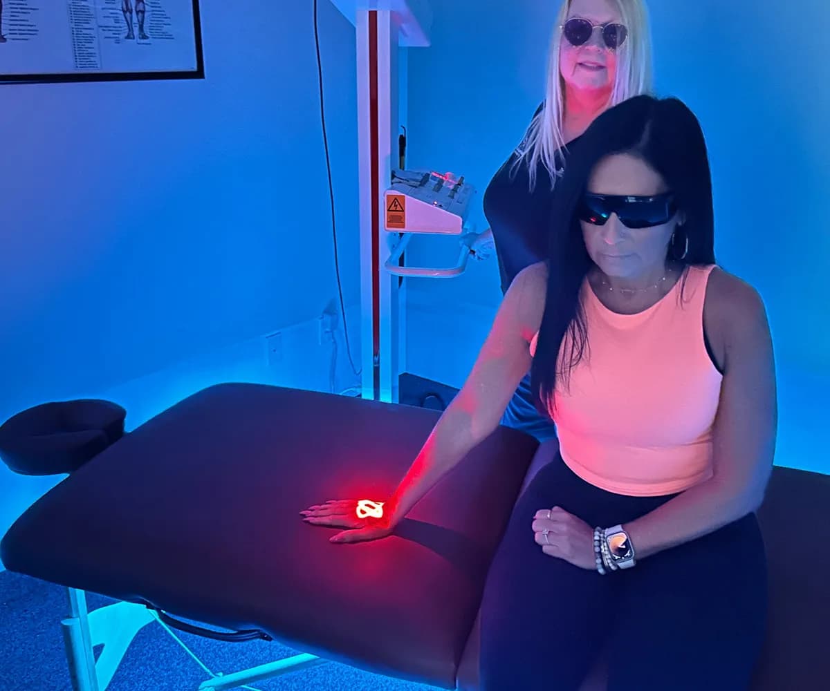 Cold laser therapy applied to a patient wearing protective eyewear at Back in Action Chiropractic in Las Vegas