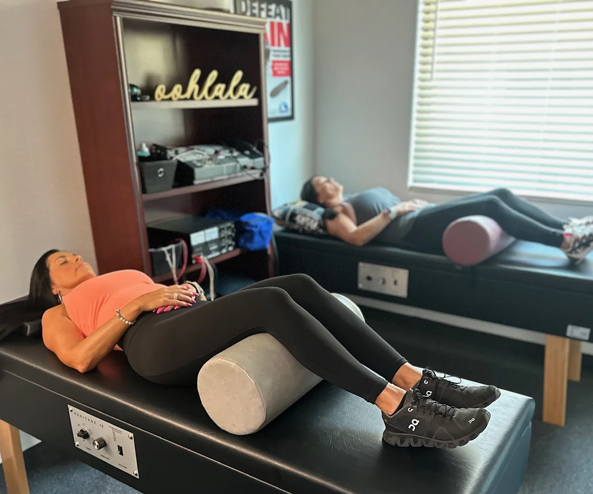 Patient receiving electrical stimulation pain relief therapy at Back in Action Chiropractic in Las Vegas